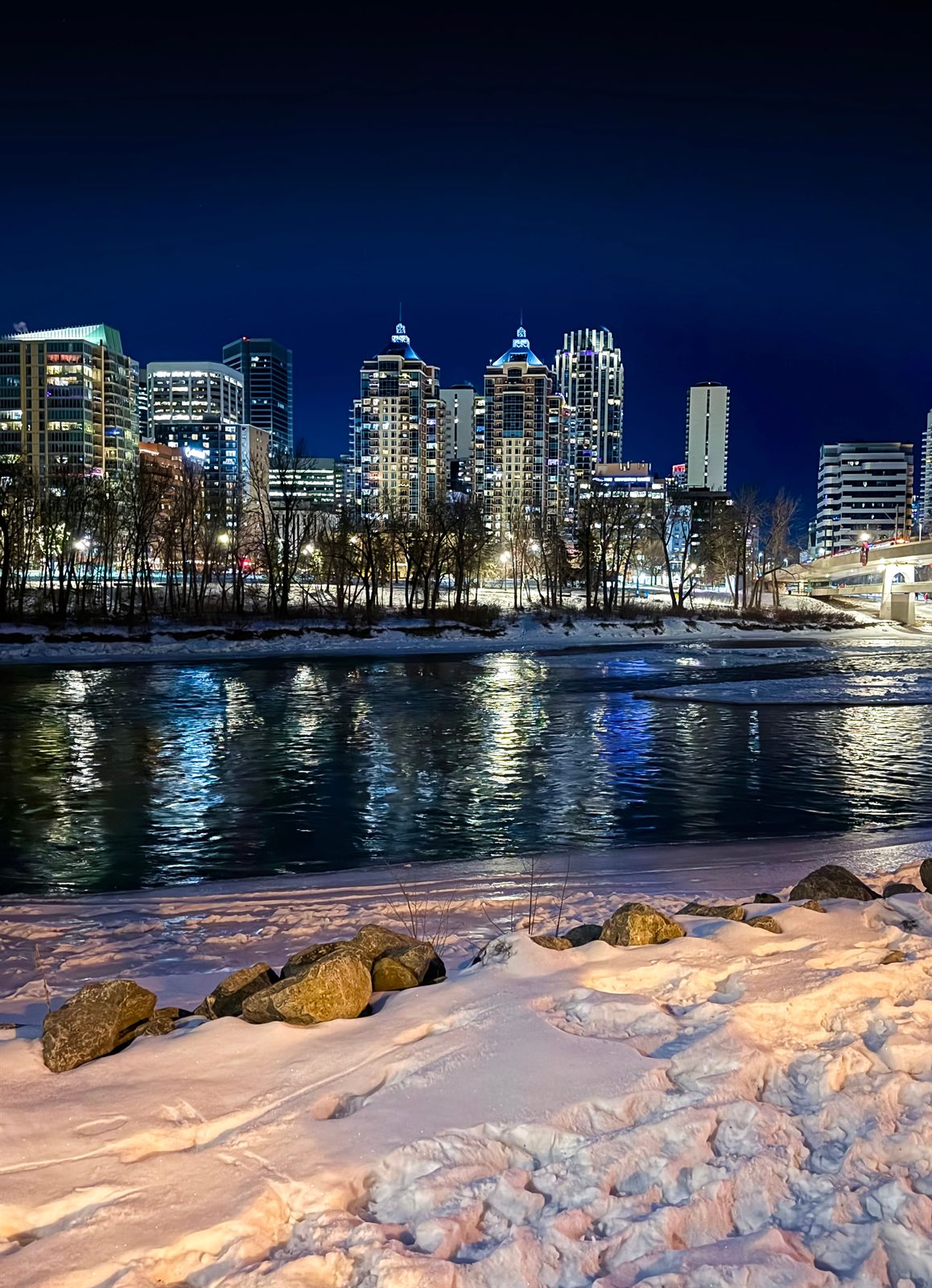 Calgary skyline reflected in the river at night